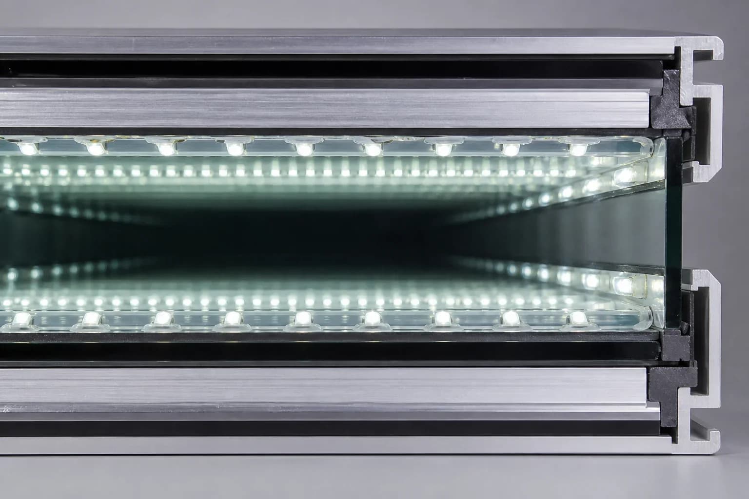 Cross-section of an infinity mirror optical stack showing one-way glass, LED cavity, and rear mirror spacing